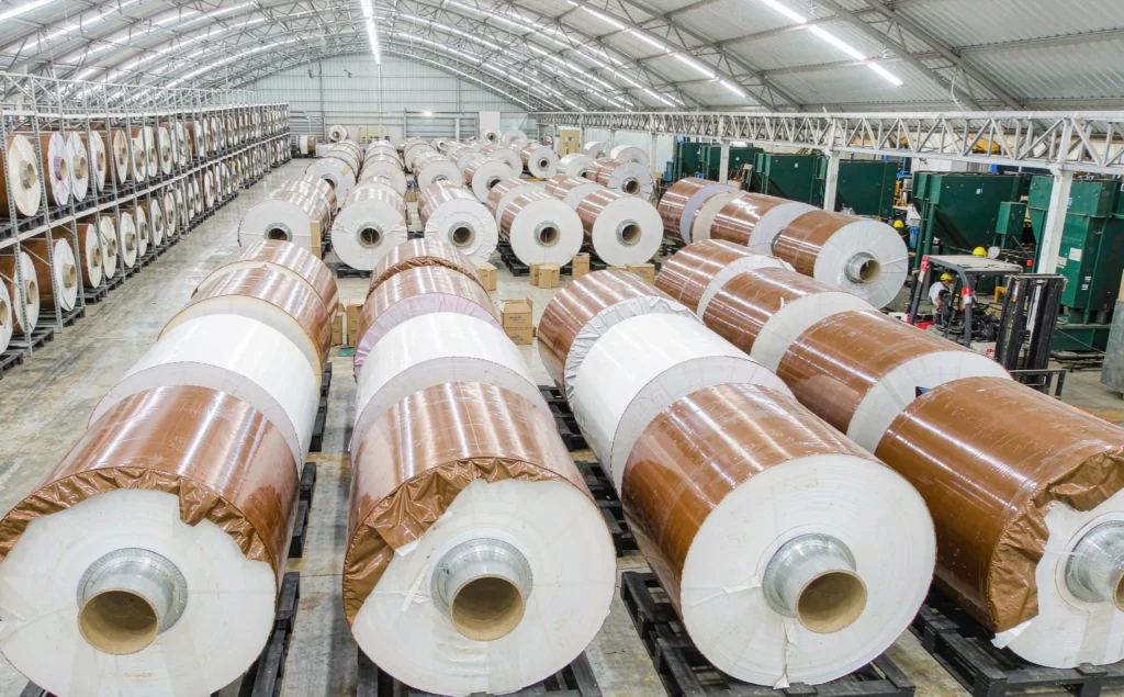 Jumbo adhesive tape rolls in warehouse